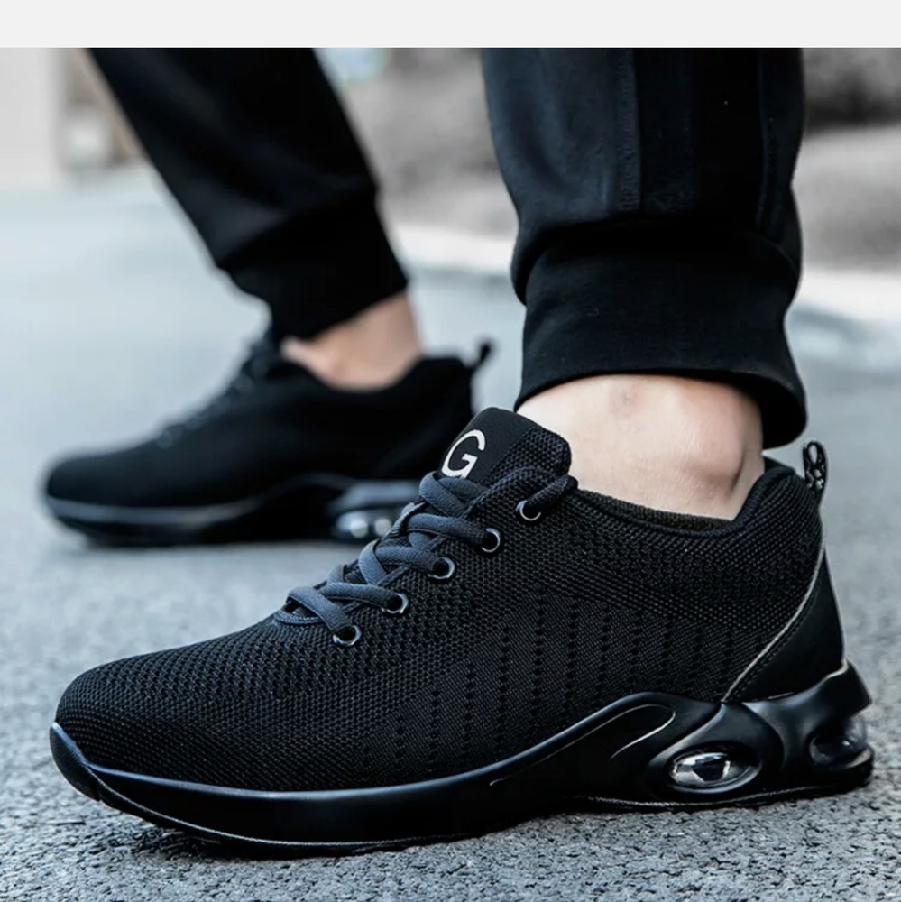 Like new size 7.5 Black Steal Toe, skid resistant sneakers